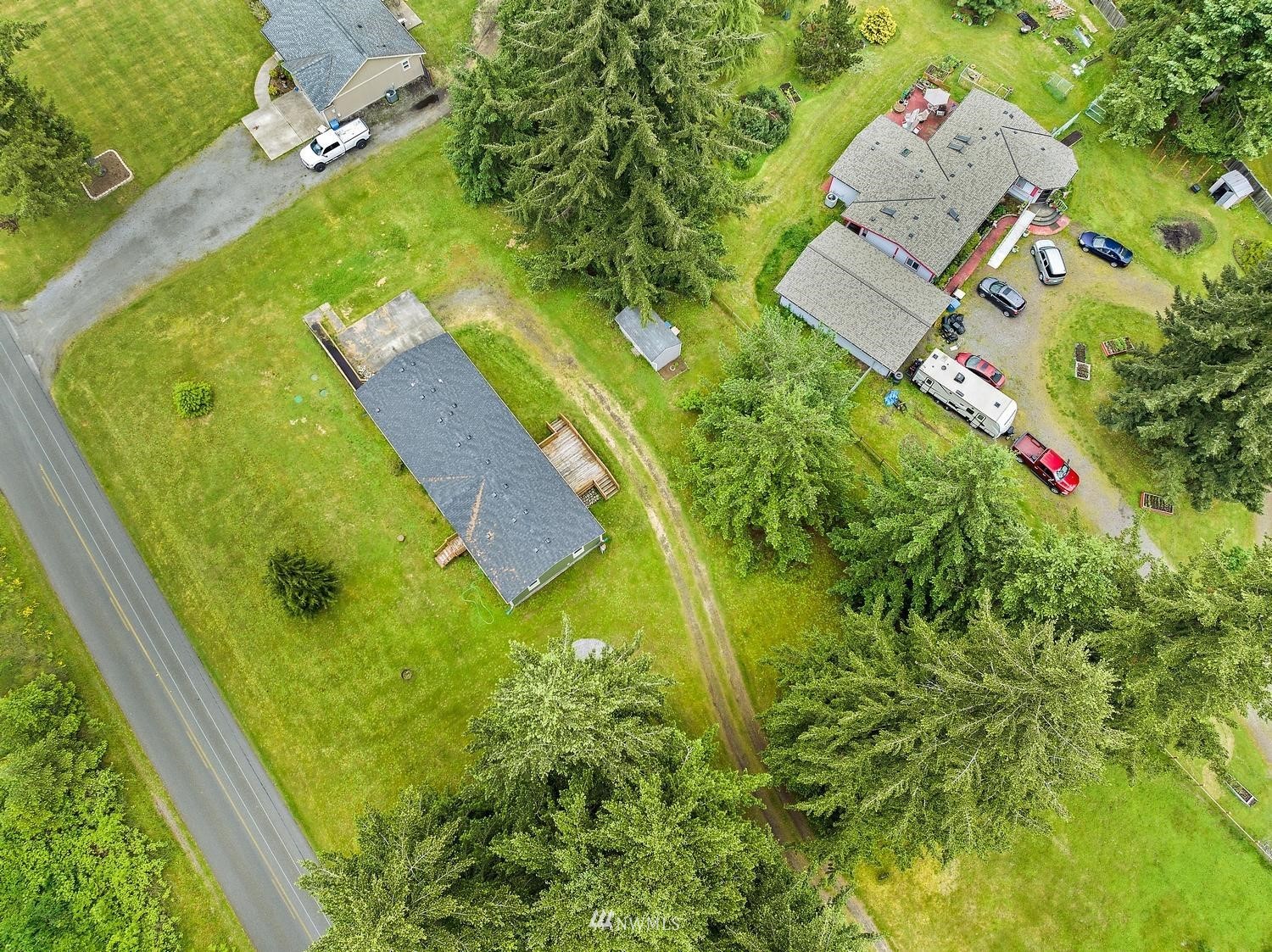 5038 186th Lane Southwest Rochester, WA 98579 - Photo 35 of 36 an aerial view of a residential houses with yard