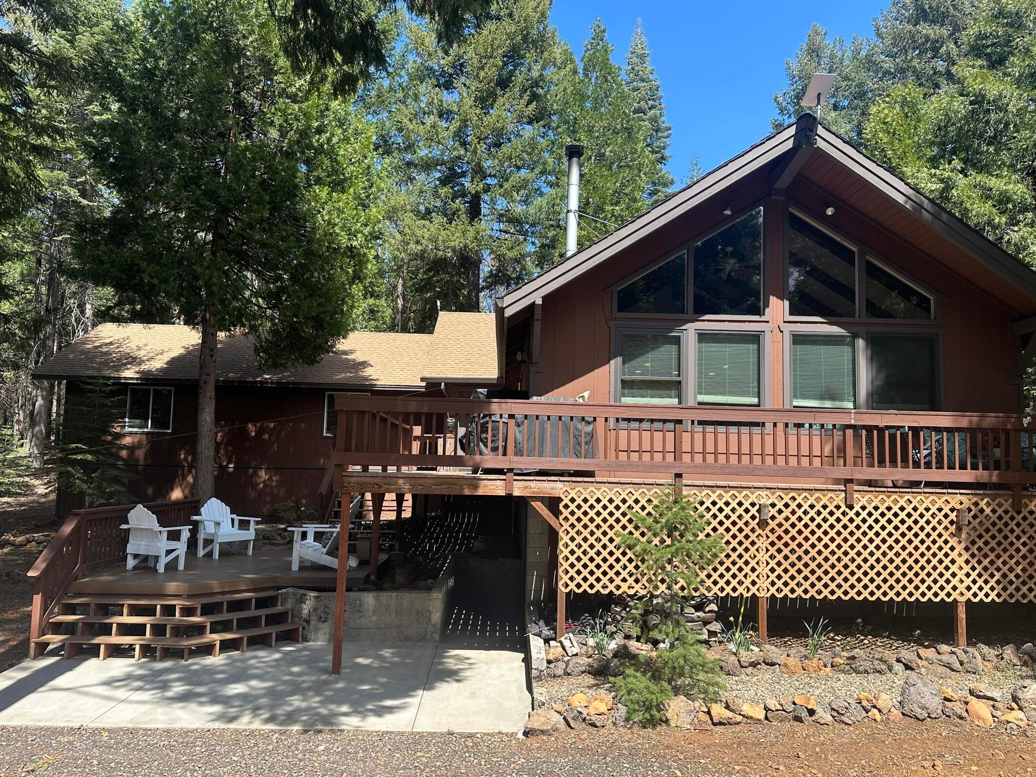 8308 Lost Mill Road Shingletown, CA 96088 - Photo 3 of 11 a view of a brick house with many windows