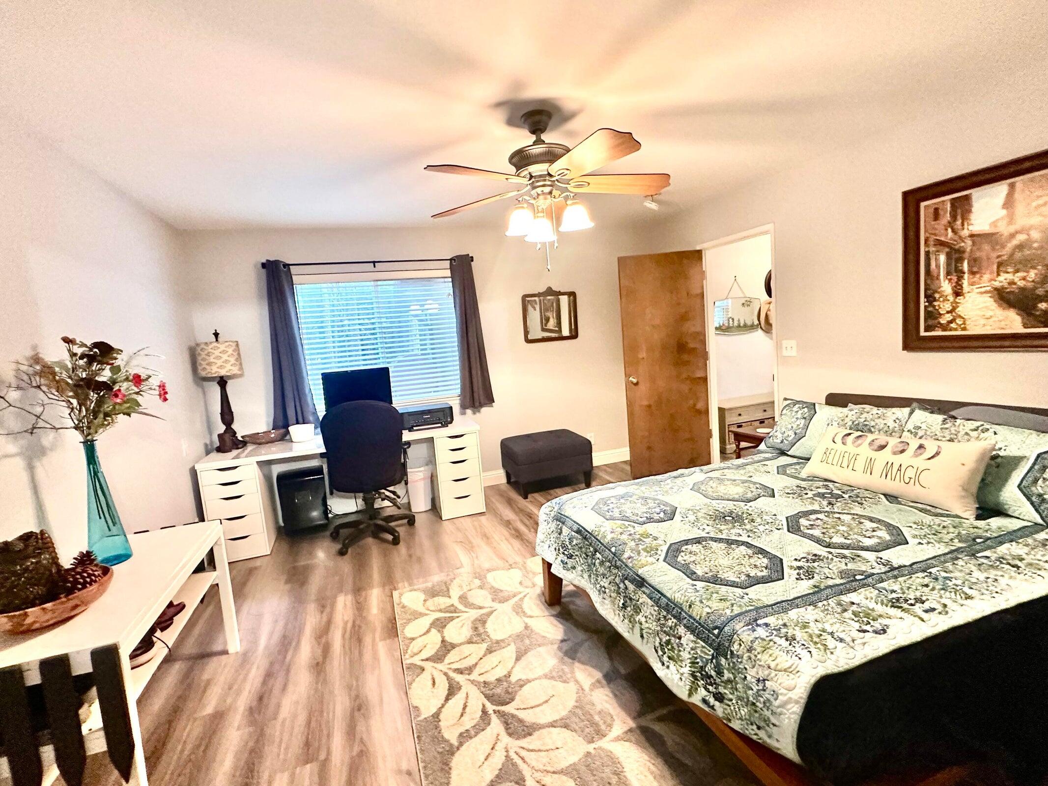 8308 Lost Mill Road Shingletown, CA 96088 - Photo 7 of 11 a bedroom with a bed and a chandelier