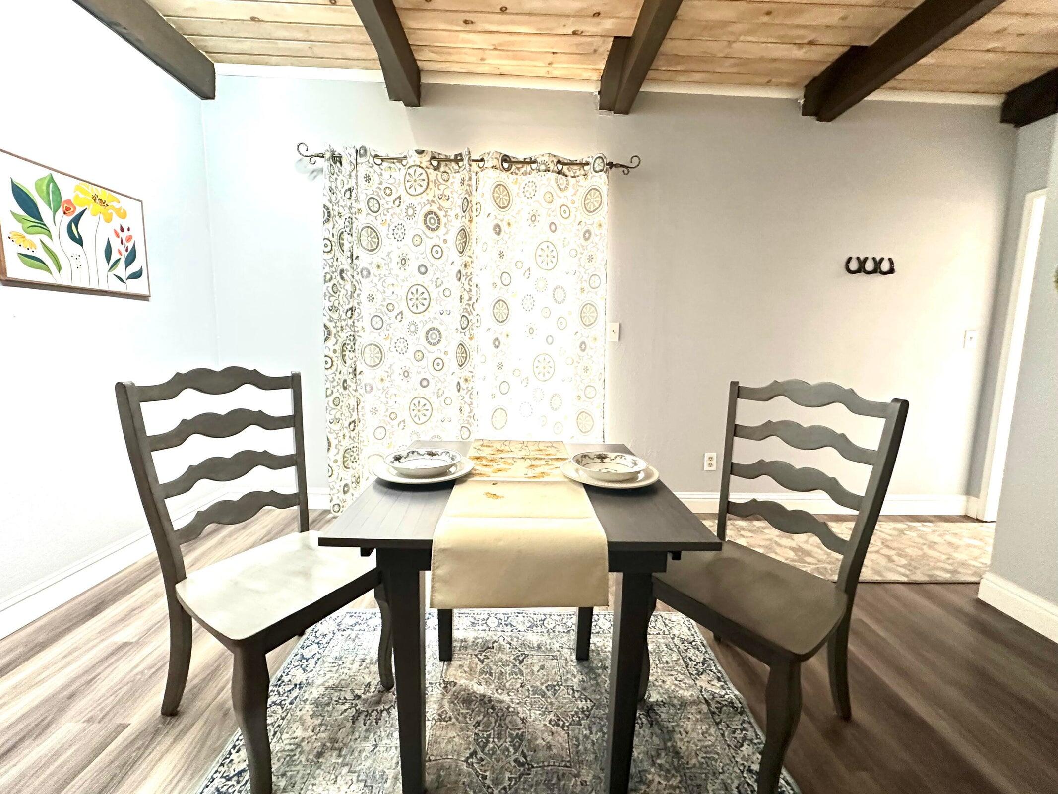 8308 Lost Mill Road Shingletown, CA 96088 - Photo 9 of 11 a view of a dining room with furniture and wooden floor