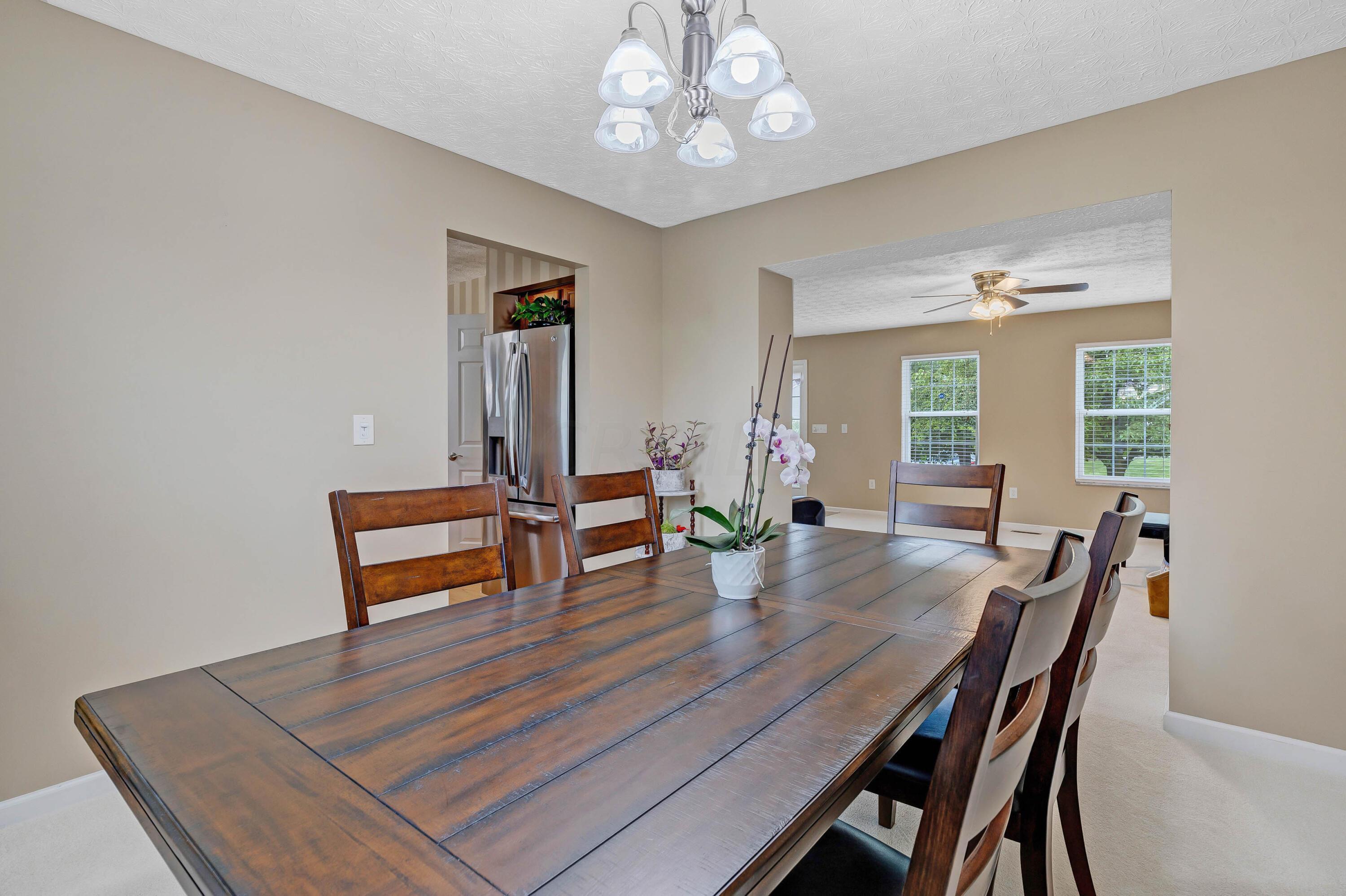 2136 Reeves Avenue Lewis Center, OH 43035 - Photo 11 of 57 • New light sand carpet ~ 2018 • Tan painted walls • Chandelier • 2” blinds