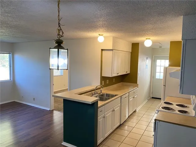 a kitchen with a stove and a sink