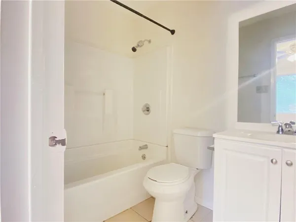 a bathroom with a toilet a sink and a bathtub