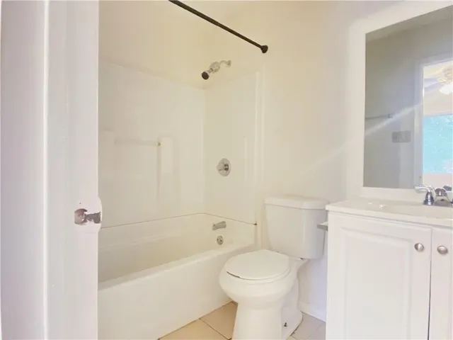 a bathroom with a toilet a sink and a bathtub