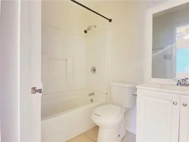 a bathroom with a toilet a sink and a bathtub