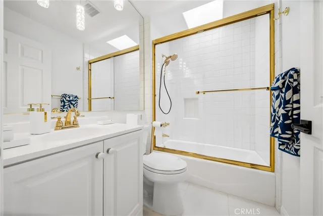 a spacious bedroom with a bed and window