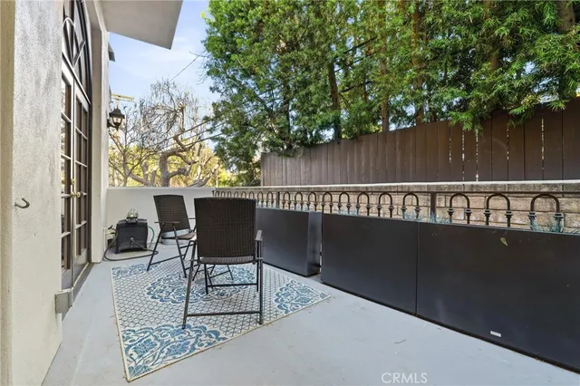a view of a chairs and table in the patio