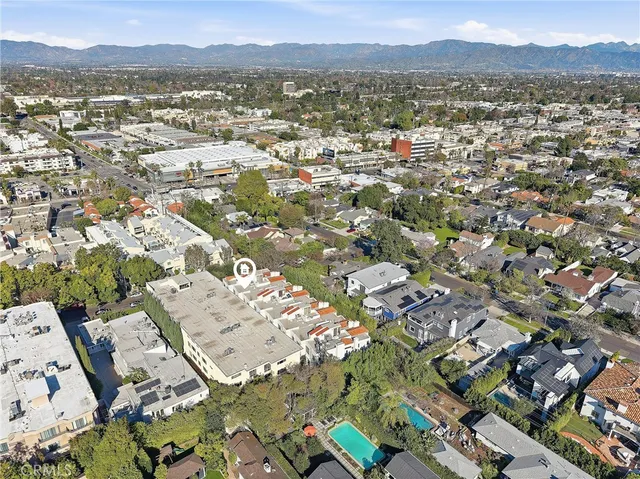 an aerial view of a house with a patio