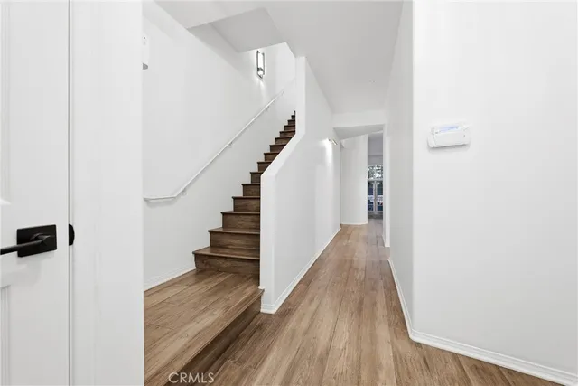 a kitchen with stainless steel appliances a refrigerator sink and cabinets