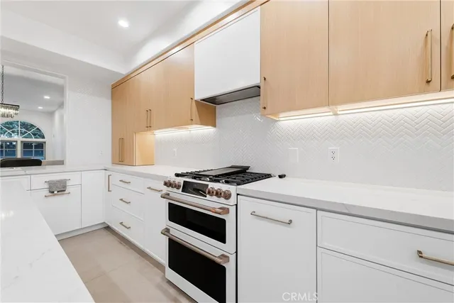 a kitchen with a cabinets and window