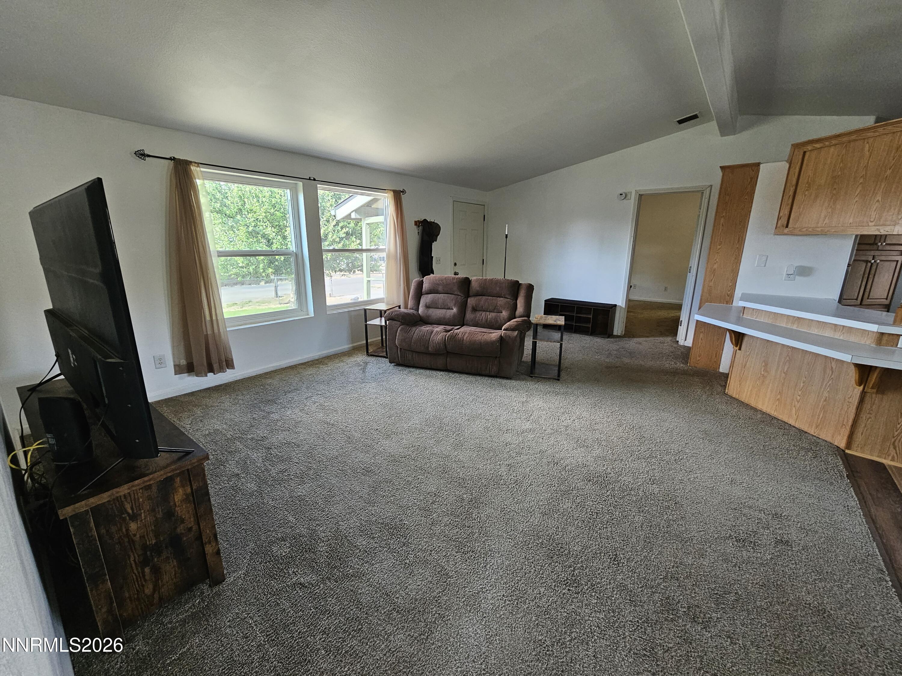 1125 Rancho Road Fernley, NV 89408 - Photo 9 of 47 a living room with furniture and a flat screen tv