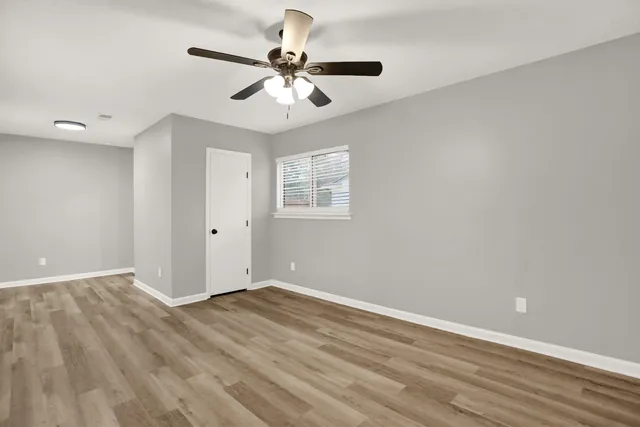 a view of an empty room with a bathroom