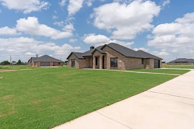 a front view of house with garden