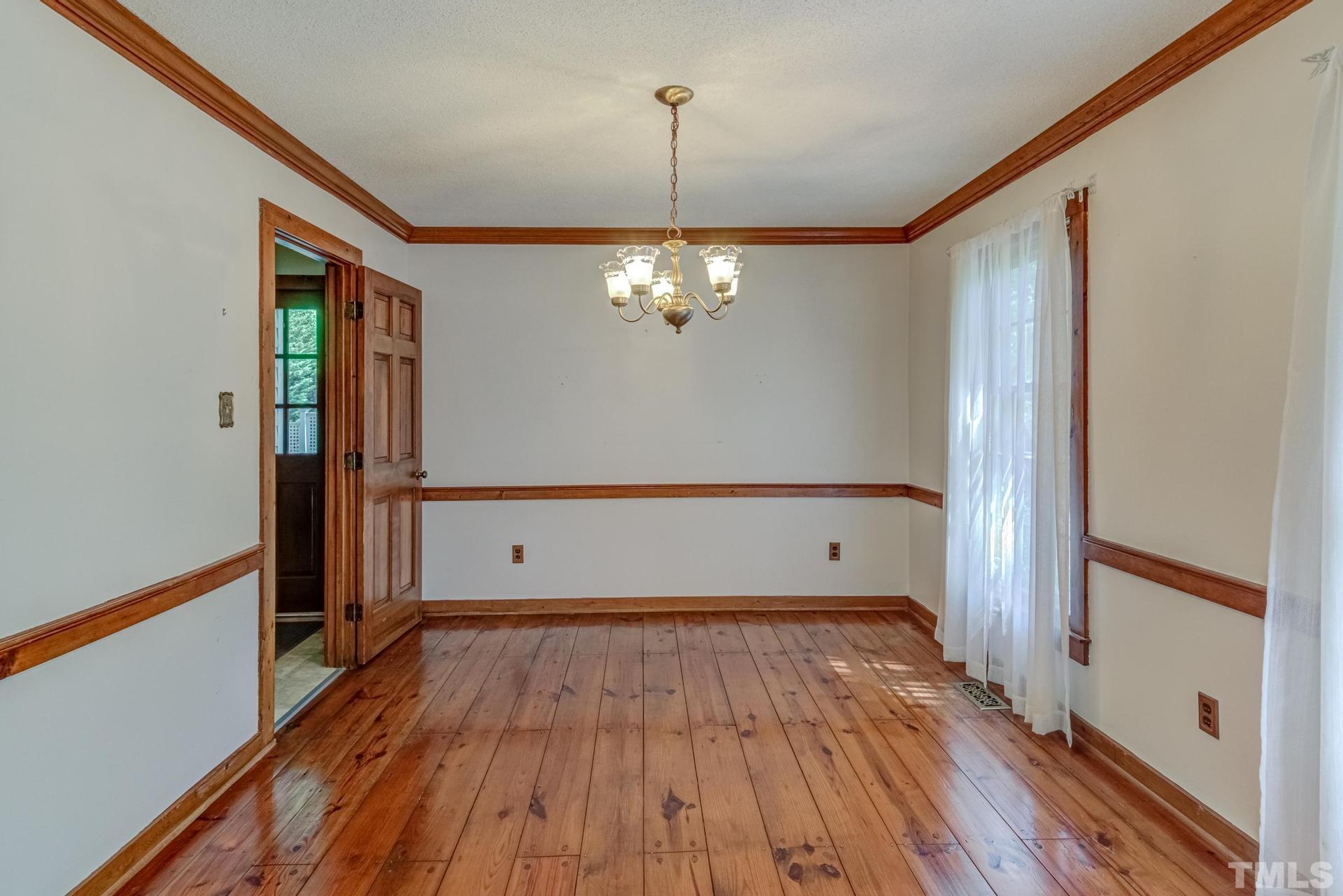 5904 Rondan Circle Raleigh, NC 27612 - Photo 9 of 44 a view of a room with wooden floor
