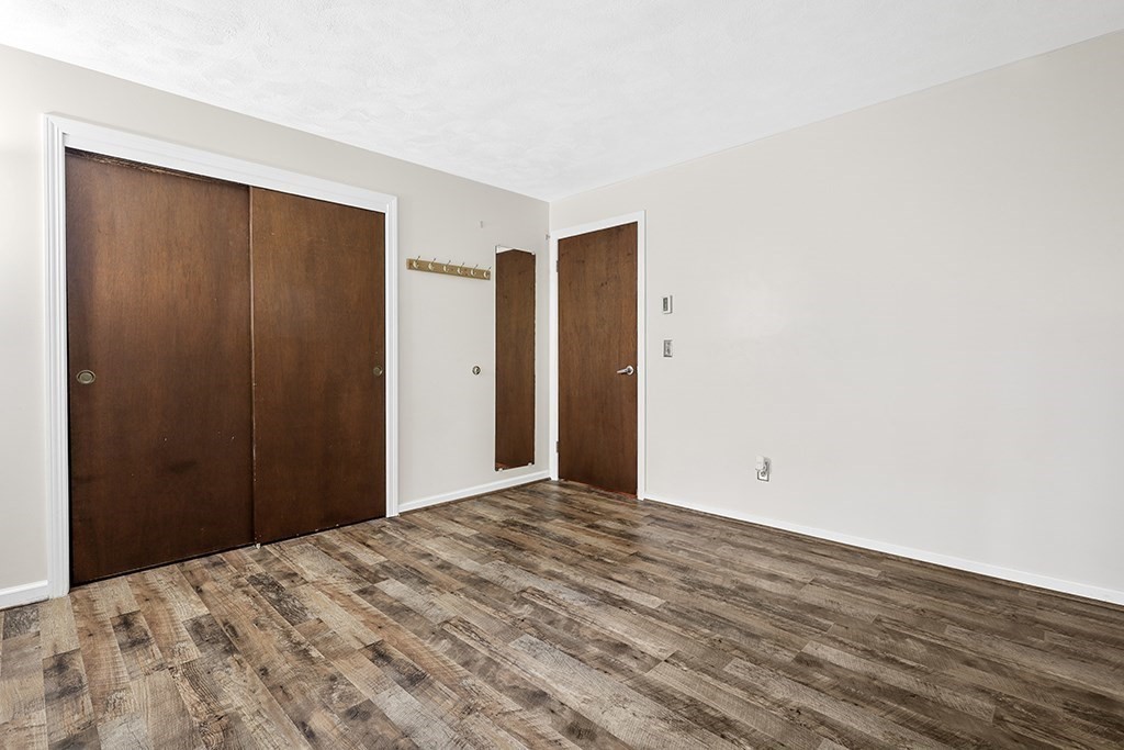 109 Maple Street, Unit E3 Attleboro, MA 02703 - Photo 13 of 18 a view of a room with wooden floor and closet