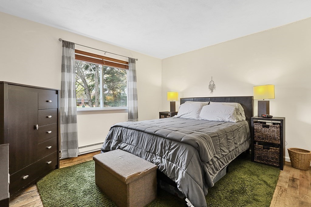 109 Maple Street, Unit E3 Attleboro, MA 02703 - Photo 15 of 18 a bedroom with a bed and a couch