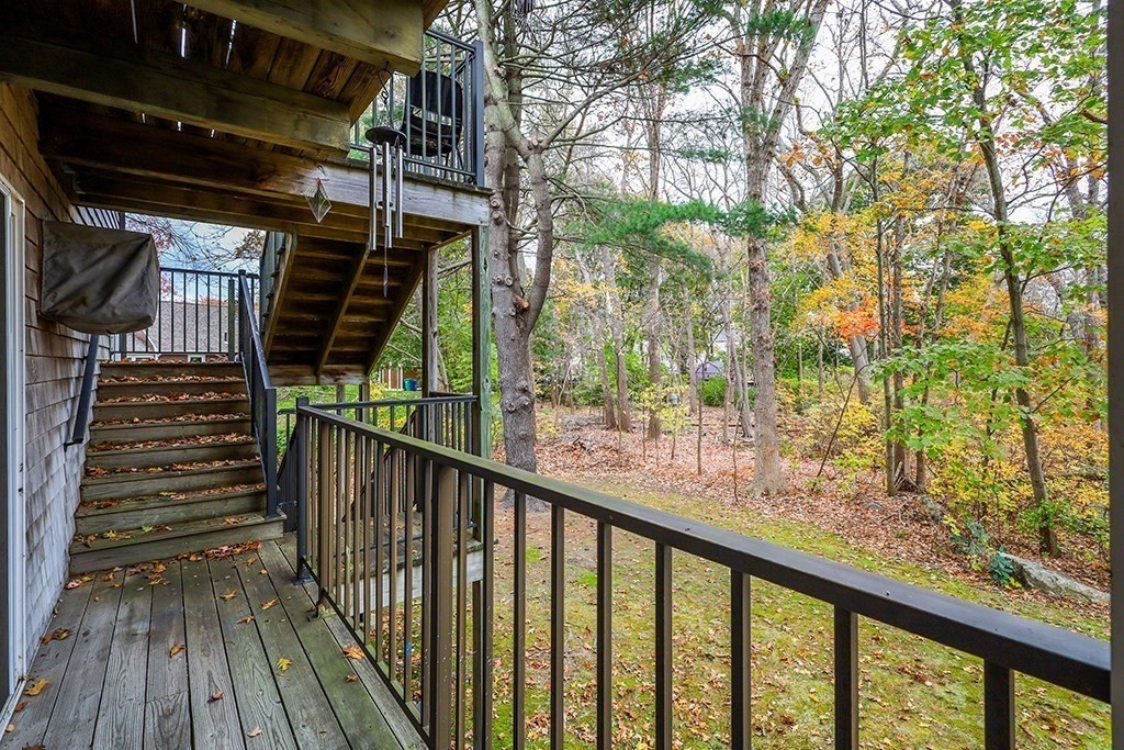 109 Maple Street, Unit E3 Attleboro, MA 02703 - Photo 17 of 18 a view of balcony with wooden floor and fence