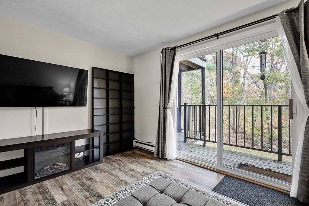109 Maple Street, Unit E3 Attleboro, MA 02703 - Photo 7 of 18 a view of livingroom with furniture and flat screen tv