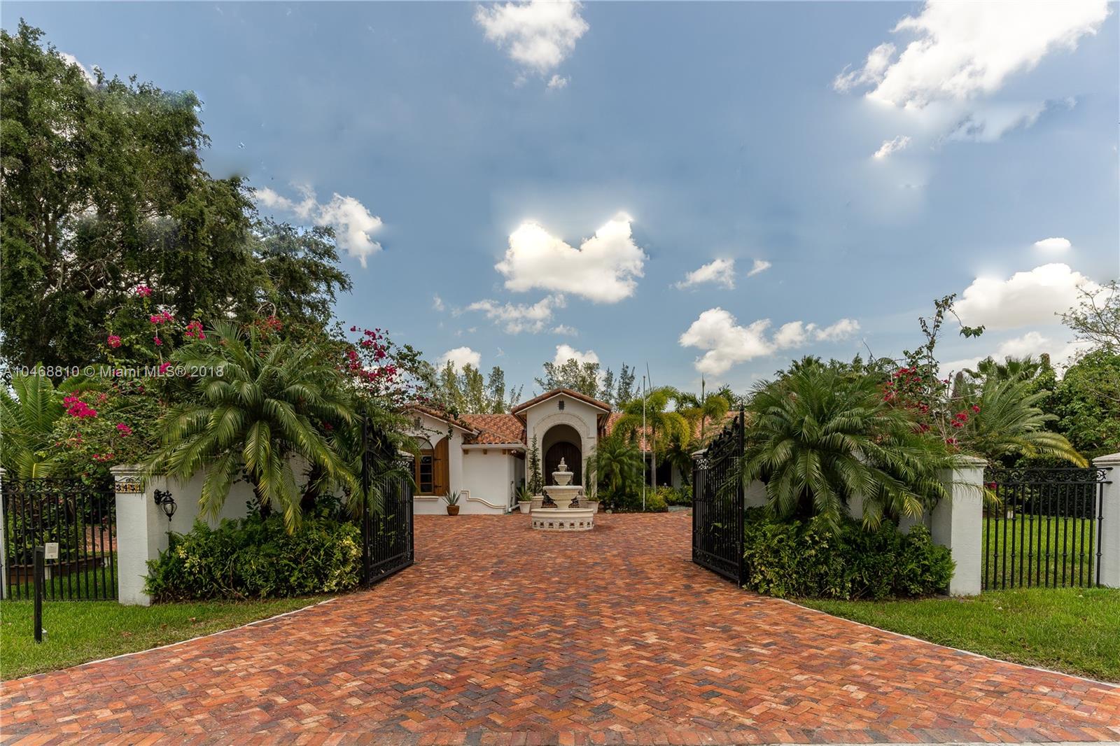 3451 Fox Trail Miramar, FL 33027 - Photo 16 of 33 a view of a house with a yard and garden