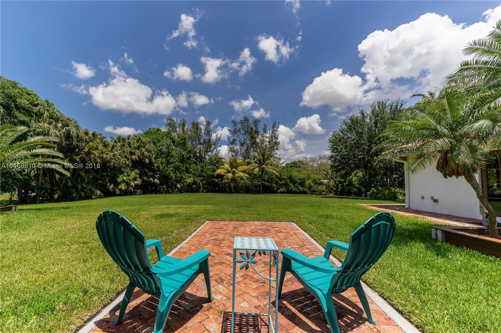 3451 Fox Trail Miramar, FL 33027 - Photo 20 of 33 a view of a swimming pool and lounge chairs