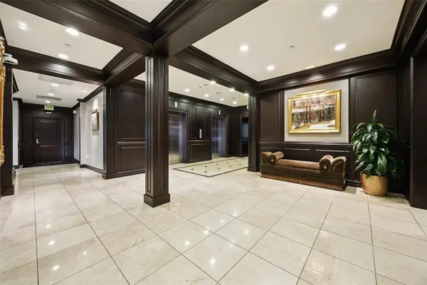a lobby with entryway and windows