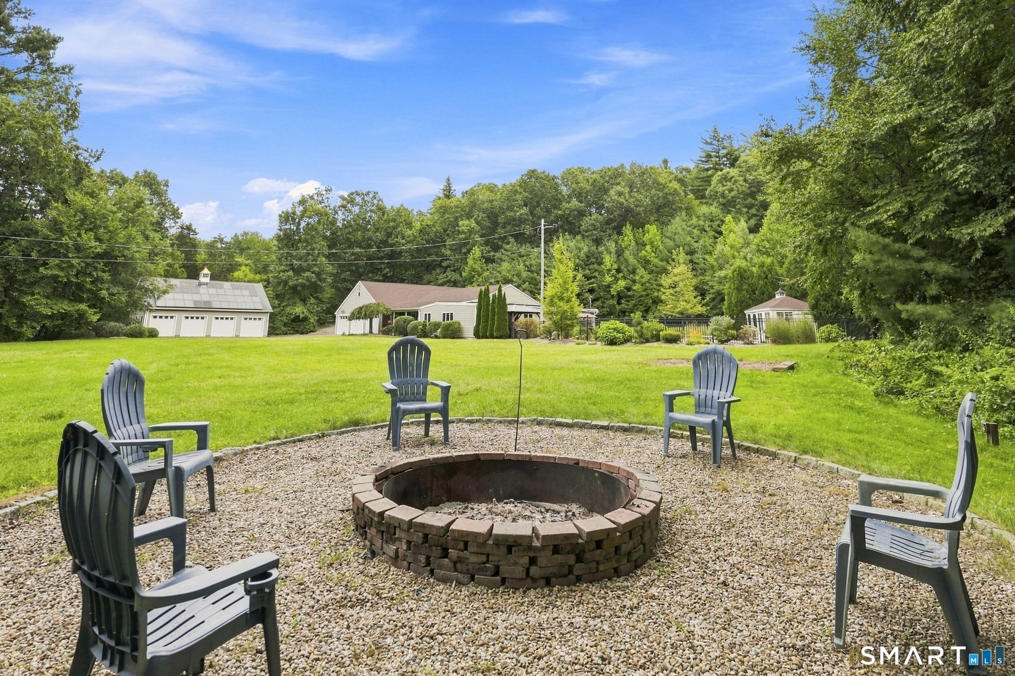 467 Somers Road Ellington, CT 06029 - Photo 26 of 37 Firepit with Adirondack chairs