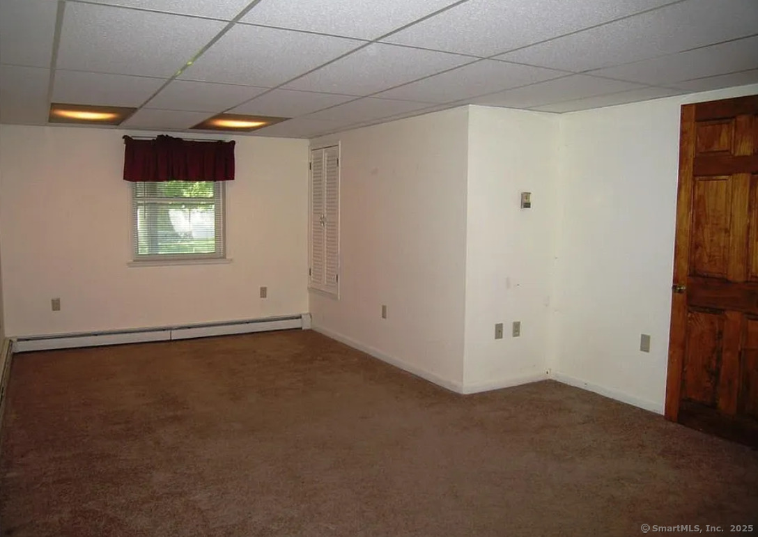 28 Lloyd Road Waterford, CT 06385 - Photo 14 of 16 a view of an empty room and window