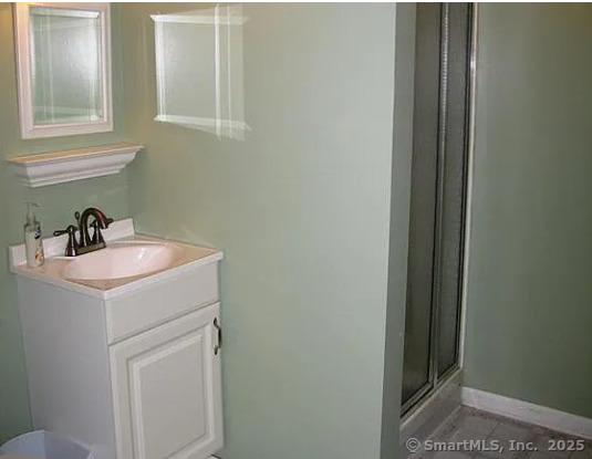 28 Lloyd Road Waterford, CT 06385 - Photo 15 of 16 a bathroom with a sink and a mirror