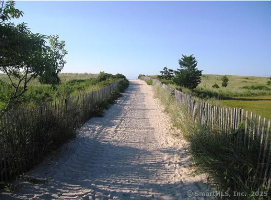 28 Lloyd Road Waterford, CT 06385 - Photo 16 of 16 a view of a pathway with a wrought fence