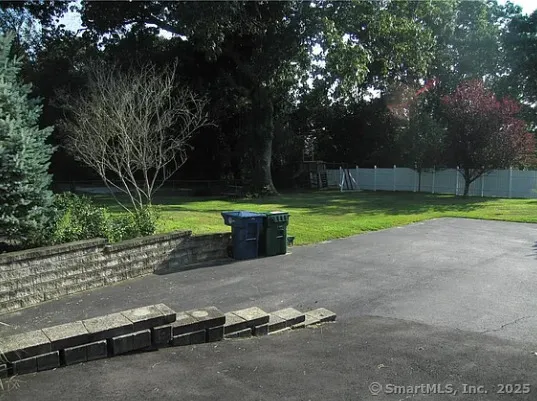 a view of a park with large trees