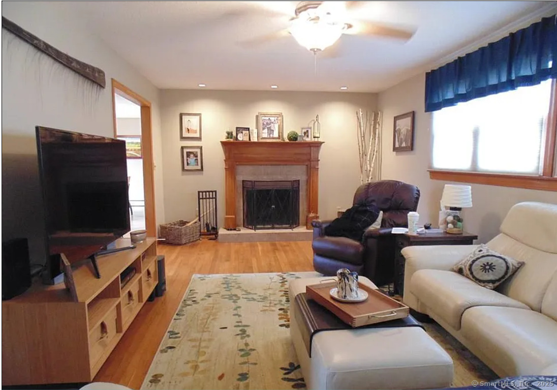 28 Lloyd Road Waterford, CT 06385 - Photo 7 of 16 a living room with furniture and a flat screen tv
