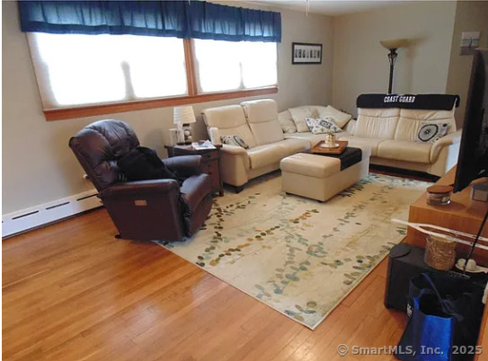 28 Lloyd Road Waterford, CT 06385 - Photo 8 of 16 a living room with furniture and a flat screen tv