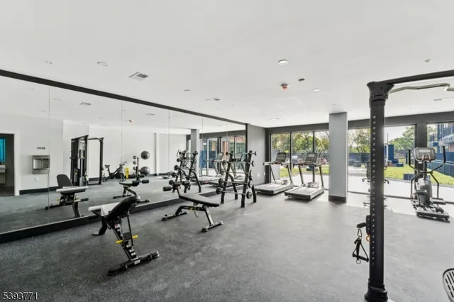 front view of a brick building with a yard