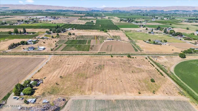 an aerial view of a house with a lake view