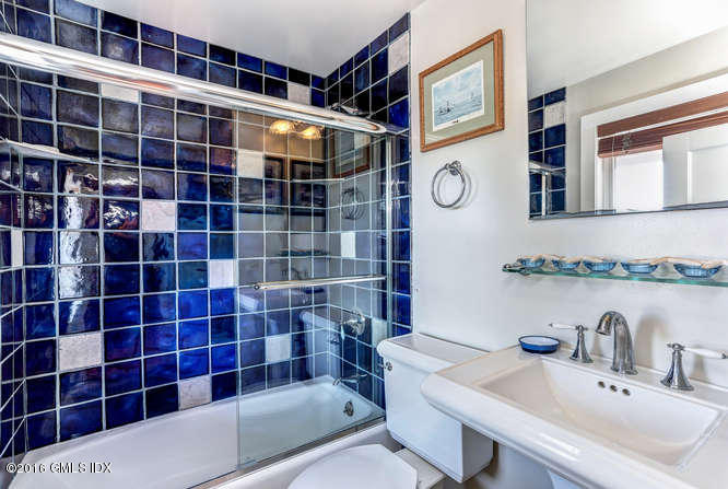 16 Apache Place Riverside, CT 06878 - Photo 15 of 27 a bathroom with a sink a toilet and shower