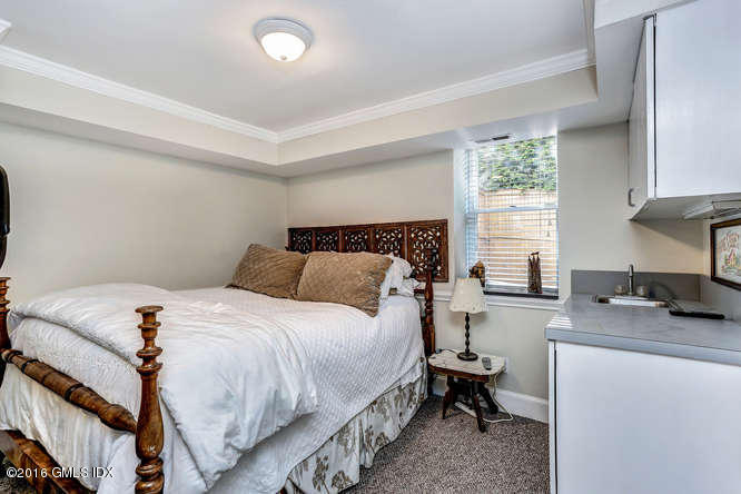 16 Apache Place Riverside, CT 06878 - Photo 16 of 27 a bedroom with a bed and a desk
