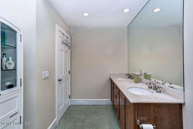 16 Apache Place Riverside, CT 06878 - Photo 17 of 27 a en suite bathroom with a sink and mirror