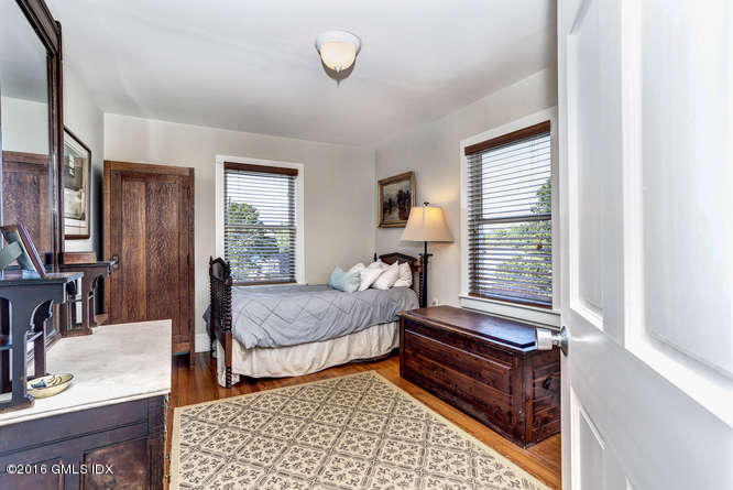 16 Apache Place Riverside, CT 06878 - Photo 19 of 27 a bedroom with furniture and a window