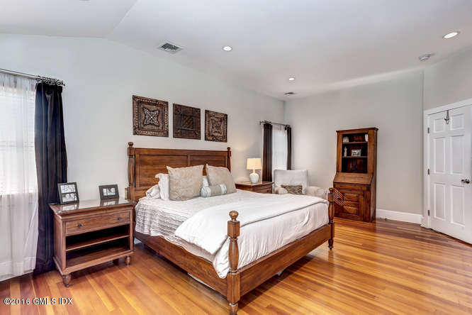 16 Apache Place Riverside, CT 06878 - Photo 20 of 27 a bedroom with a bed and wooden floor