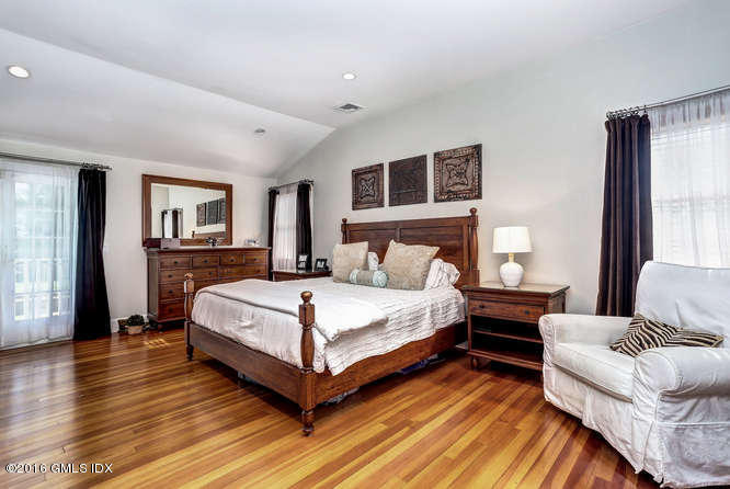 16 Apache Place Riverside, CT 06878 - Photo 21 of 27 a bedroom with a bed and a large window