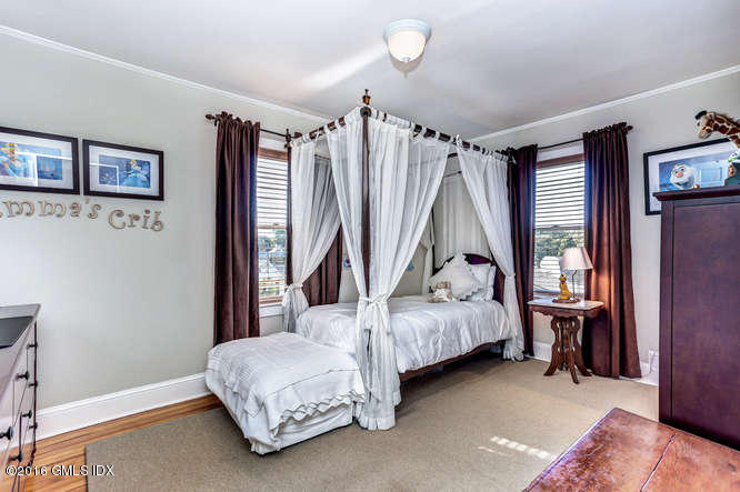 16 Apache Place Riverside, CT 06878 - Photo 22 of 27 a bedroom with a bed and a window