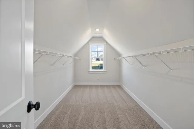 an empty room with windows and entrance