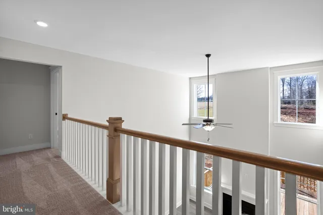 a view of a hallway with windows