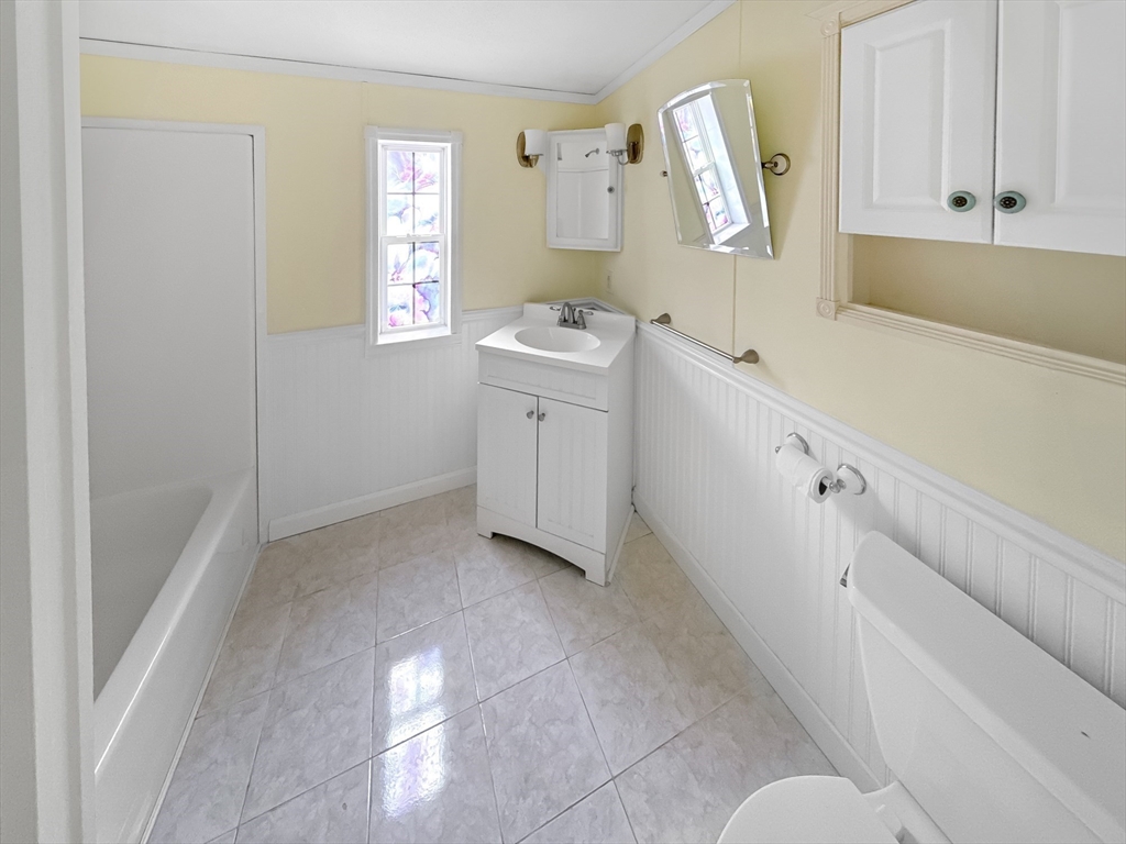 4 Francis Street Wareham, MA 02538 - Photo 8 of 12 a room with a white cabinets and sink