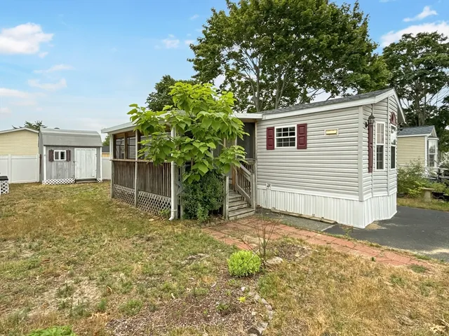 a house with trees in the background