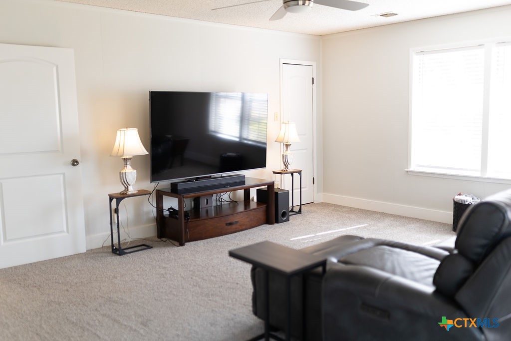 188 Cavalry Road Victoria, TX 77905 - Photo 14 of 26 a living room with furniture and a flat screen tv