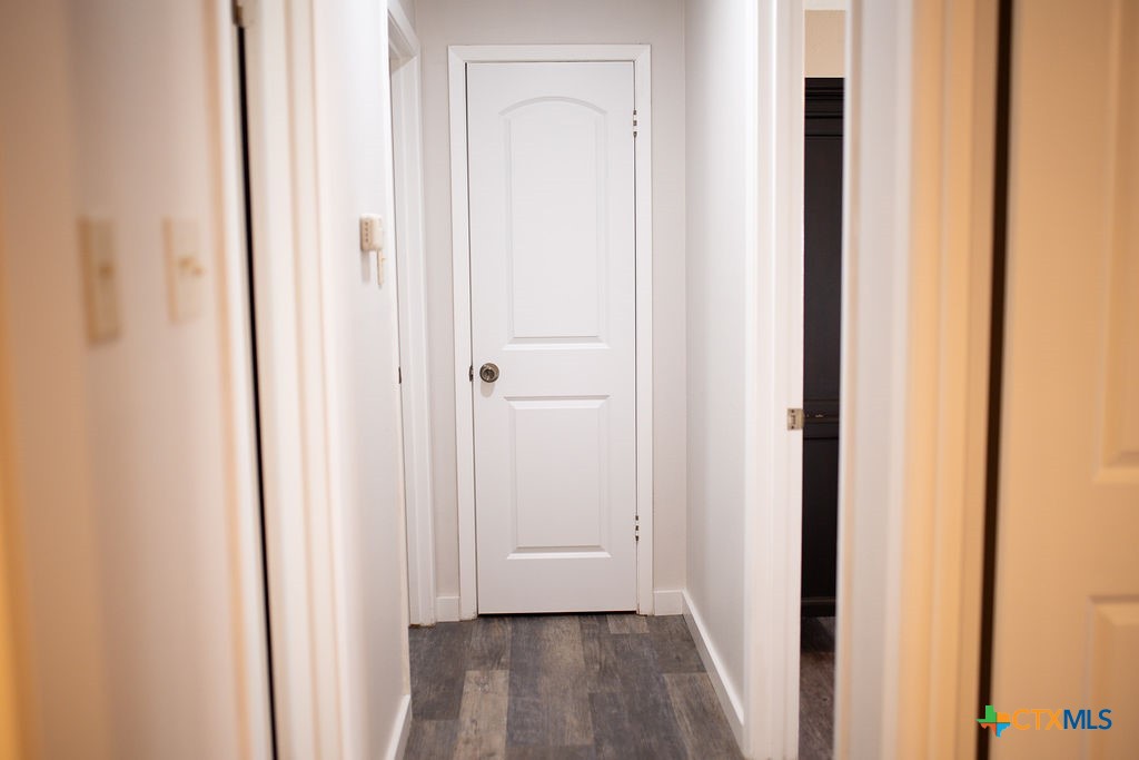 188 Cavalry Road Victoria, TX 77905 - Photo 15 of 26 a view of a hallway with wooden floor