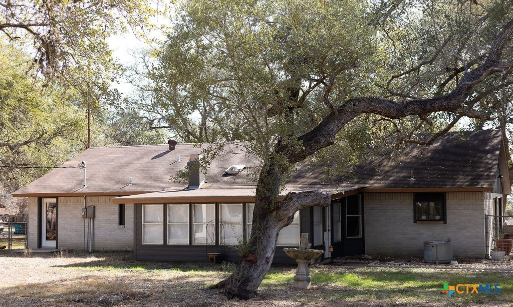 188 Cavalry Road Victoria, TX 77905 - Photo 5 of 26 a view of a house with a yard large tree and a tree