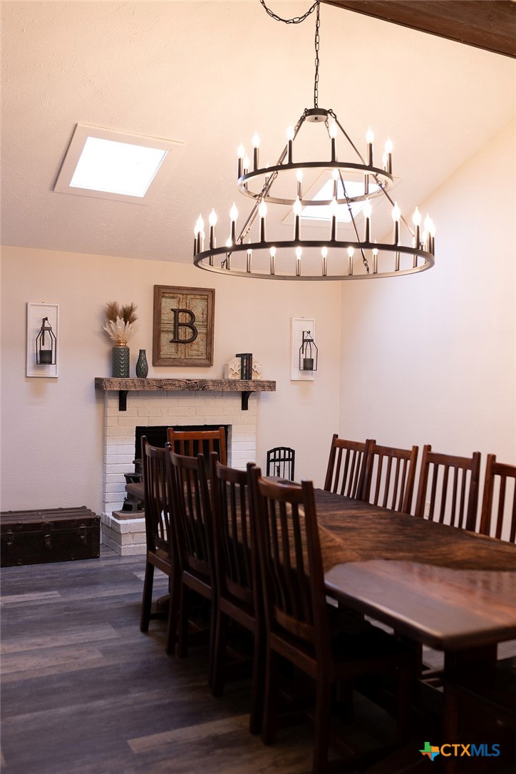 188 Cavalry Road Victoria, TX 77905 - Photo 9 of 26 a view of a dining room with furniture and wooden floor