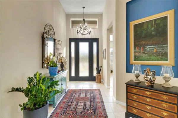 a view of hallway with furniture and a flower pot